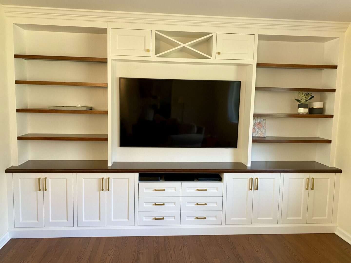 A Television Unit With Open Wooden Shelves