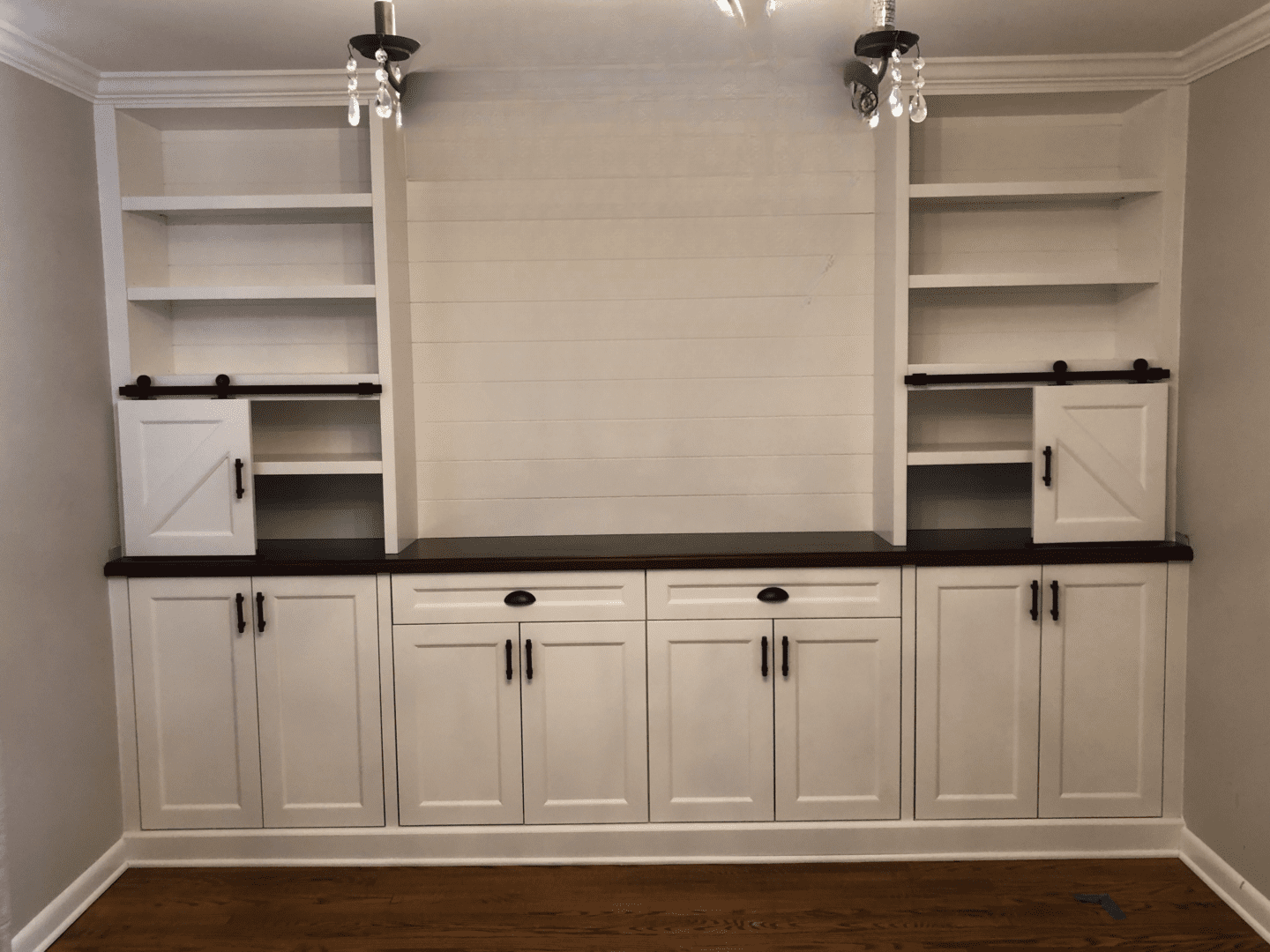 A well cleaned empty cupboard with all white interiors