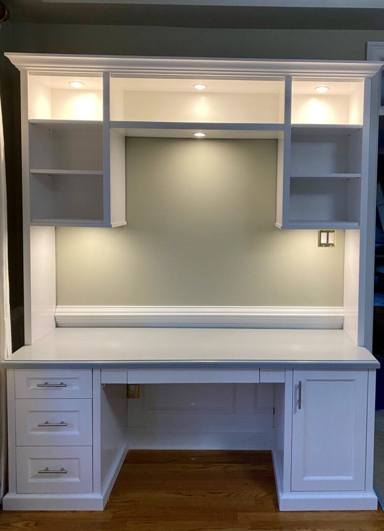 A bunch of cabinets and shelves custom-made in white