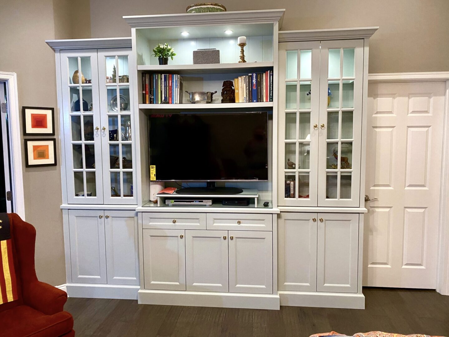A Television Unit With Bookshelves and Glass Cabinets