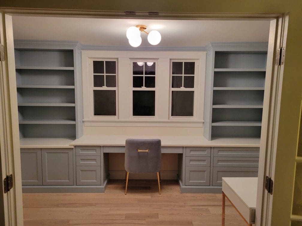 A room with cabinets and shelves custom made